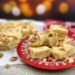 Walnut fudge on a red plate.
