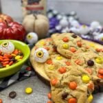 Halloween cookies on the counter with Reese's pieces