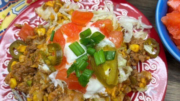 Ground beef casserole with tomatoes, green onions, and corn