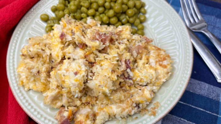Crack chicken and peas on a beige plate