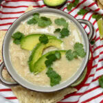 White chicken chili in a brown soup bowl.
