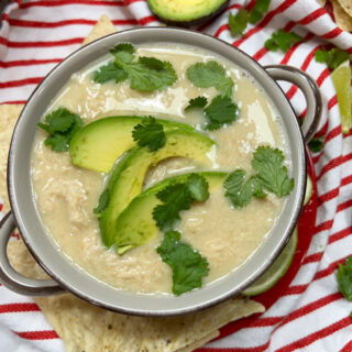 White chicken chili in a brown soup bowl.