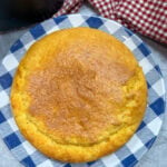 Air fryer cornbread on a white and blue checked plate.