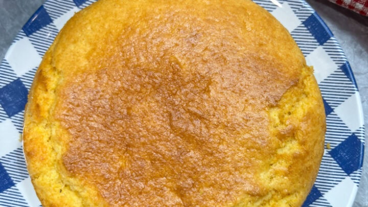 Air fryer cornbread on a white and blue checked plate.