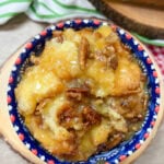 Bread pudding in a bowl with blue and red.