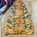 Spinach christmas tree appetizer on parchment paper.