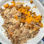 Copycat Ruth's Chris sweet potato casserole on a plate.
