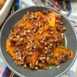 Candied sweet potatoes in a gray bowl.