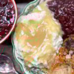 Gravy in on top of mashed potatoes.