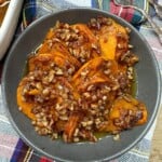 Sliced candied sweet potato casserole with brown sugar pecan topping