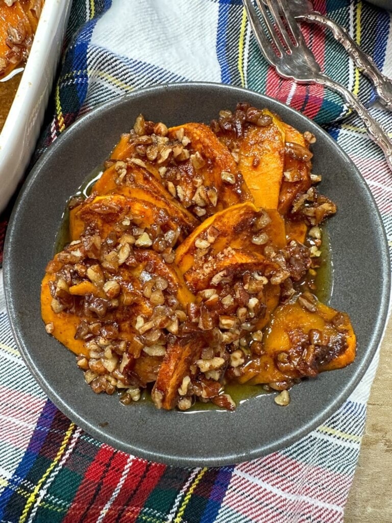 Sliced candied sweet potato casserole with brown sugar pecan topping