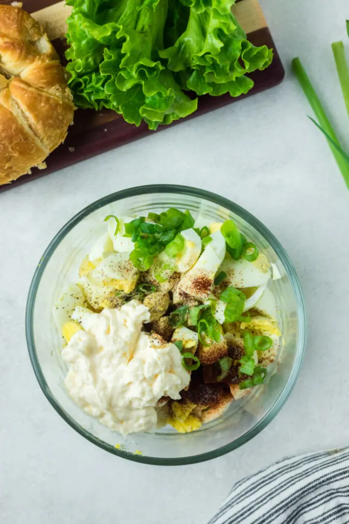 Egg salad ingredients in a bowl.
