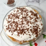 French silk pie on the counter. There are chocolate shavings on the pie.