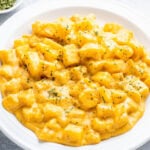 Crock Pot cheesy potatoes in a white bowl