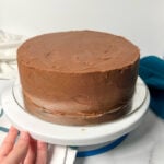 Chocolate cake on a cake stand.