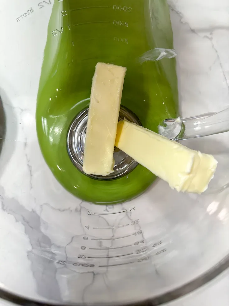 Butter in a large stand mixer.