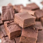 Pieces of chocolate fudge stacked on top of each other.