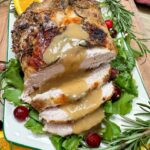 Turkey breast with gravy on top.