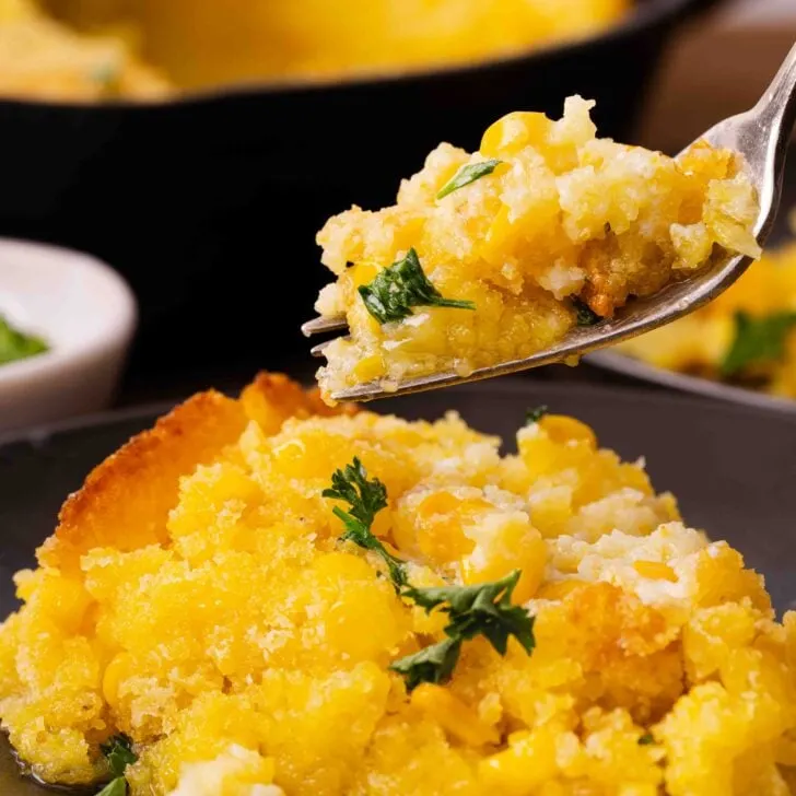 cornbread on a fork and in a dark bowl.