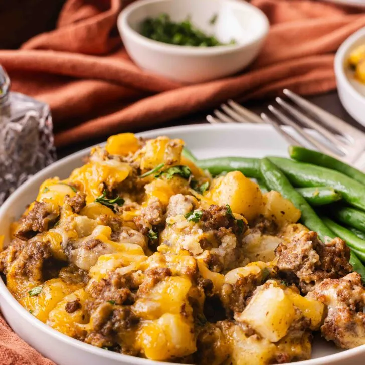 5-ingredient ground beef casserole cooked and on a light blue plate.