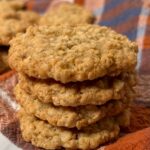 Oatmeal cookies stacked up on top of each other.