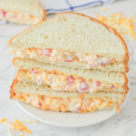 Stacked pimento cheese sandwiches.