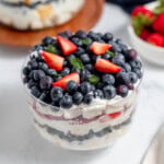 Patriotic berry dessert in a glass trifle bowl.