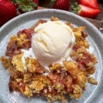 rhubarb cake with strawberries and topped with ice cream.