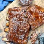BBQ pork ribs on a cutting board.