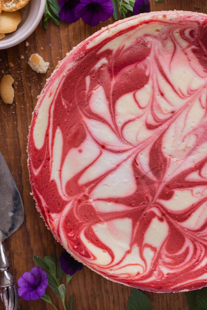 Red velvet cheesecake on a counter.