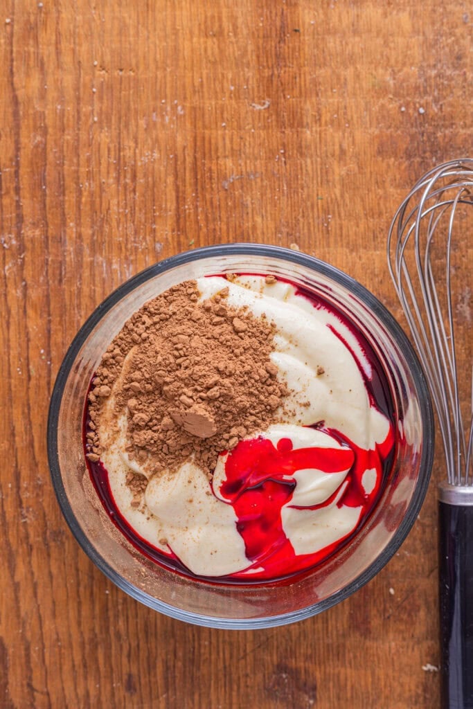 Red food dye in cream cheese mixture. 