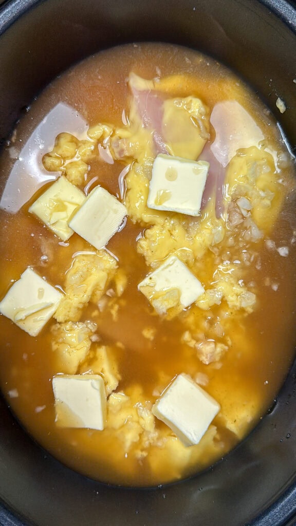 Chicken broth in a crock pot.