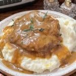 Crock Pot beef and gravy over mashed potatoes.