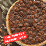 A whole pecan pie with a golden crust sits on a rustic wooden table, topped with pecan halves. Sliced pecans and a pie server are beside it. Text reads: Old Fashioned Pecan Pie Recipe—The Perfect Dessert Idea for the Holidays!.