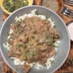 Slow cooker ground beef on top of rice in a bowl.