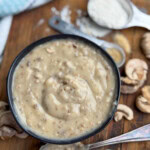 Condensed mushroom soup in a black bowl.
