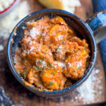 Slow cooker cheese tortellini in a blue bowl.