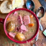 Corned Beef Hash Soup in a red bowl.