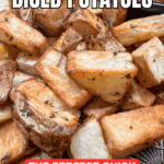 Close-up of golden, crispy Air Fryer Diced Potatoes (With Skin) garnished with herbs. Text on the image reads, “Easy Air Fryer Diced Potatoes” and “The Perfect Quick Side Dish.”.