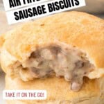 A close-up of a biscuit stuffed with creamy sausage filling, with overlay text: Air Fryer Sausage Gravy Stuffed Biscuits. Buttons say Take it on the go! and Get the Recipe! Website URL is also visible.
