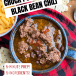 A bowl of chili with beef and black beans sits on a plaid cloth next to tortilla chips and shredded cheese. Text highlights Crock Pot Beef and Black Bean Chili (No Browning), 5-minute prep, 5 ingredients, and a recipe link.